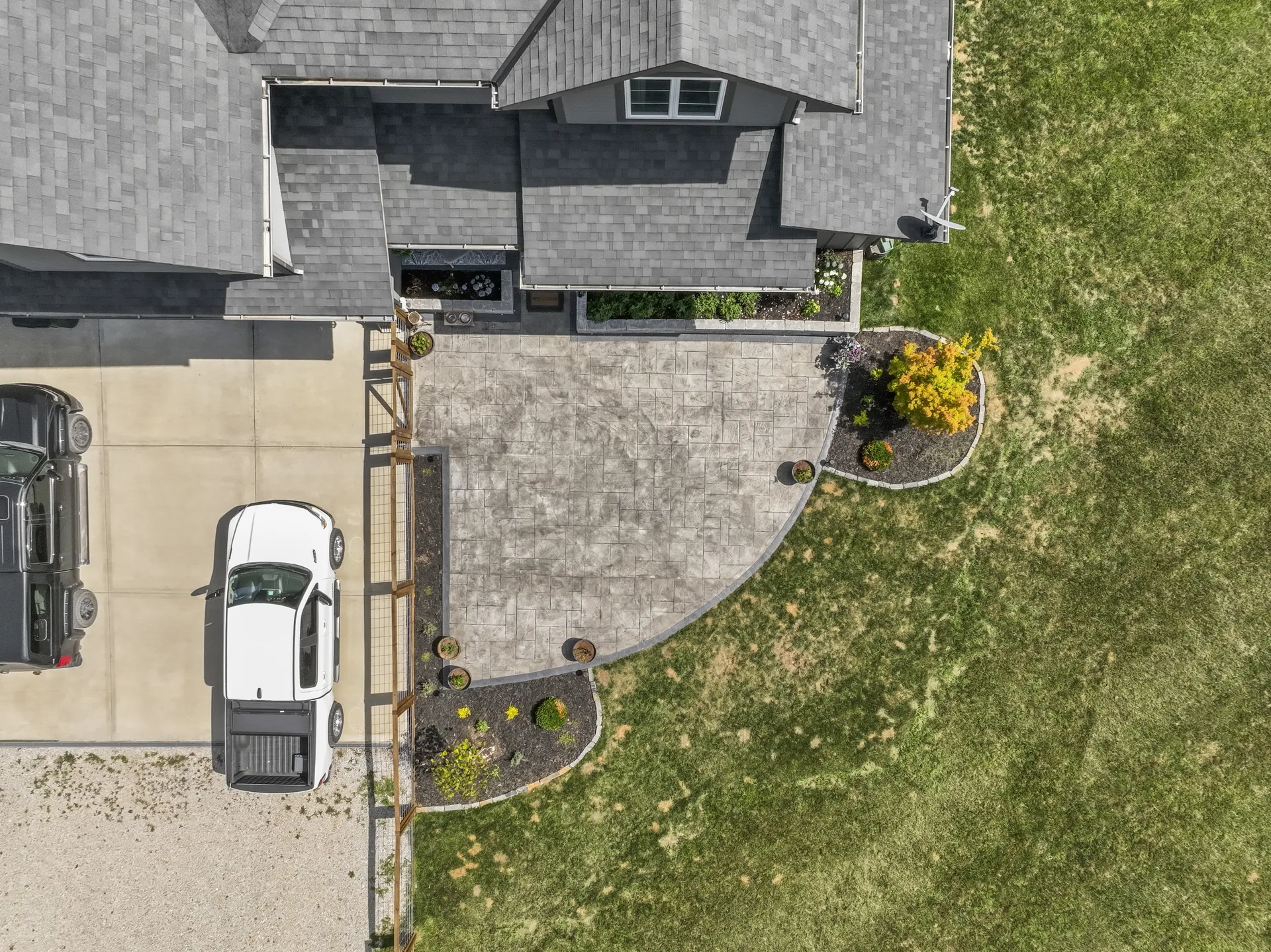Top-down view of the patio and curved planting beds