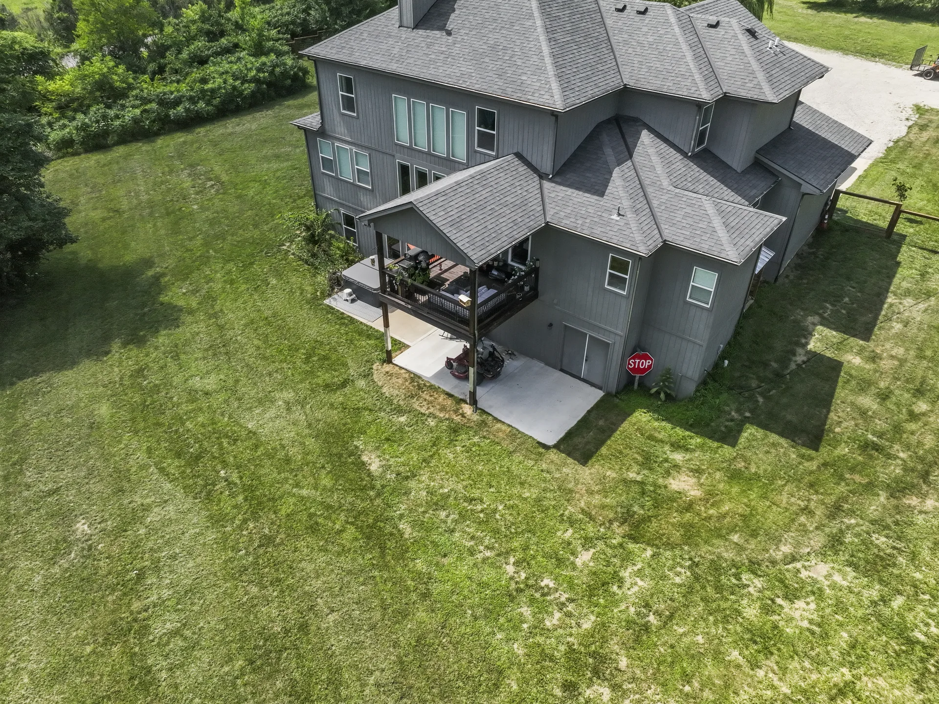 Backyard aerial view of the patio and lawn