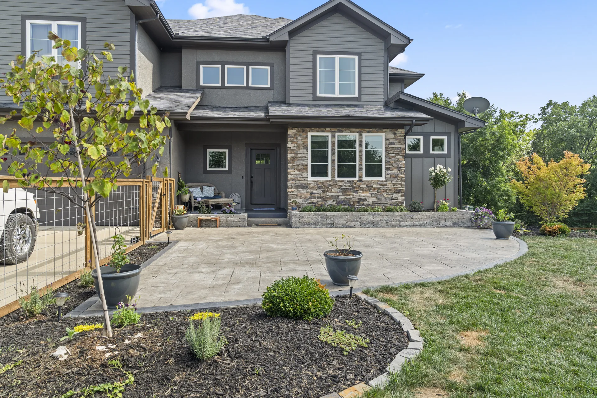 Paver patio with raised planters and outdoor seating