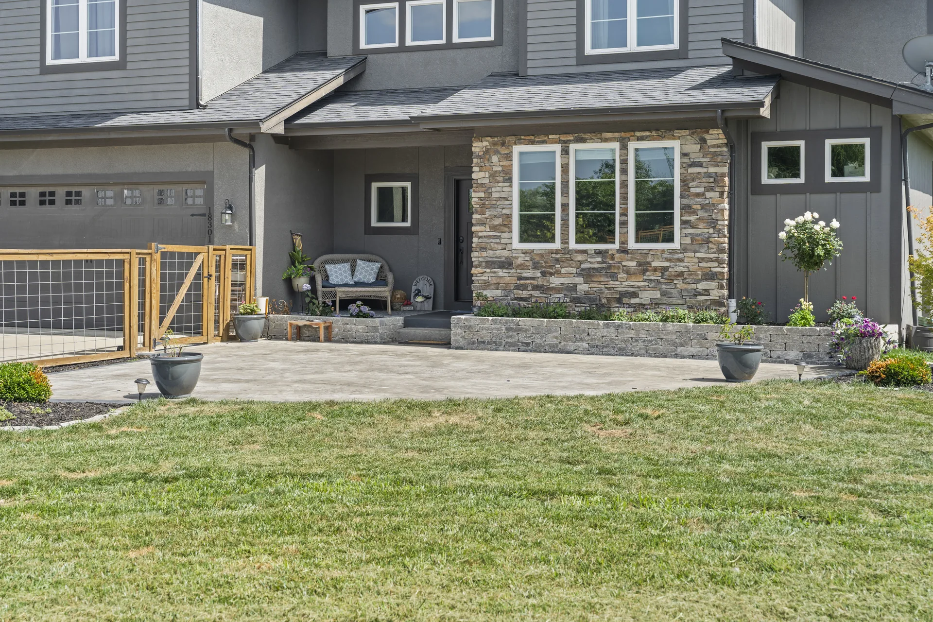 Broad patio surface opening toward the lawn