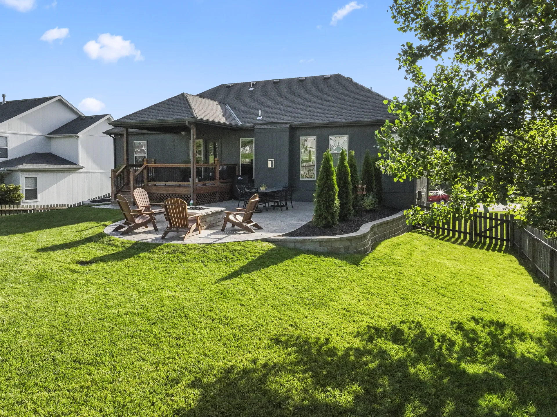 Backyard view of the patio opening into the grass