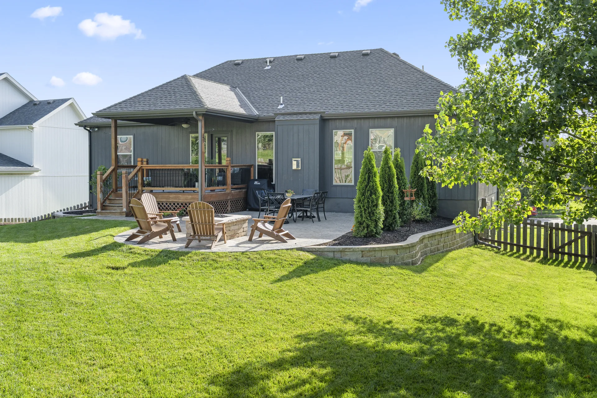 Ground-level view of the fire pit and covered deck