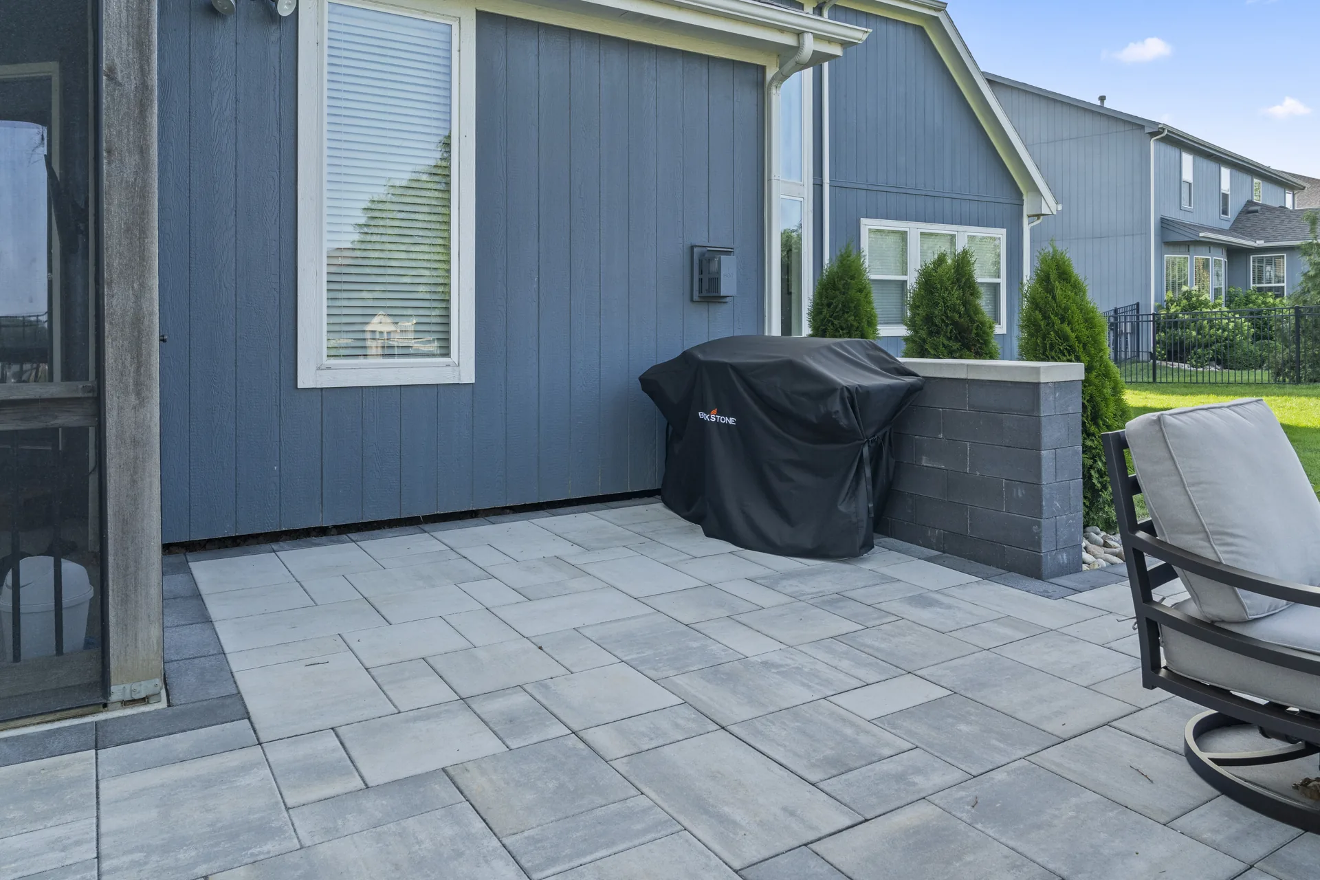 Grill and outdoor seating on the patio