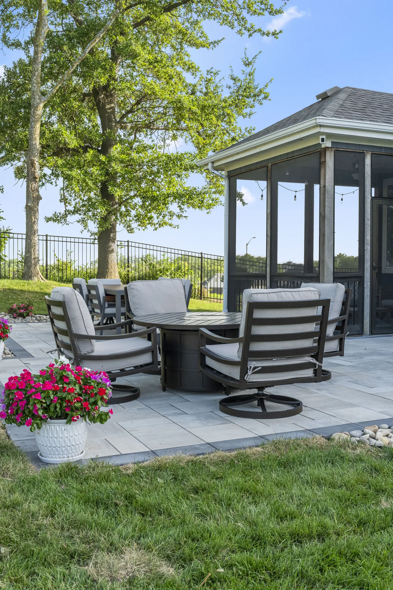 Lounge area with flowering plants in the foreground