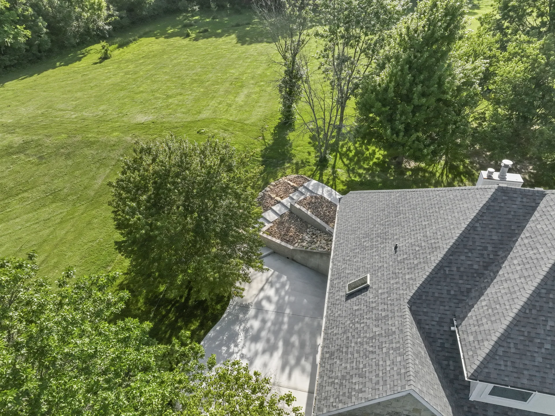 Retaining-wall tiers viewed from above the roofline
