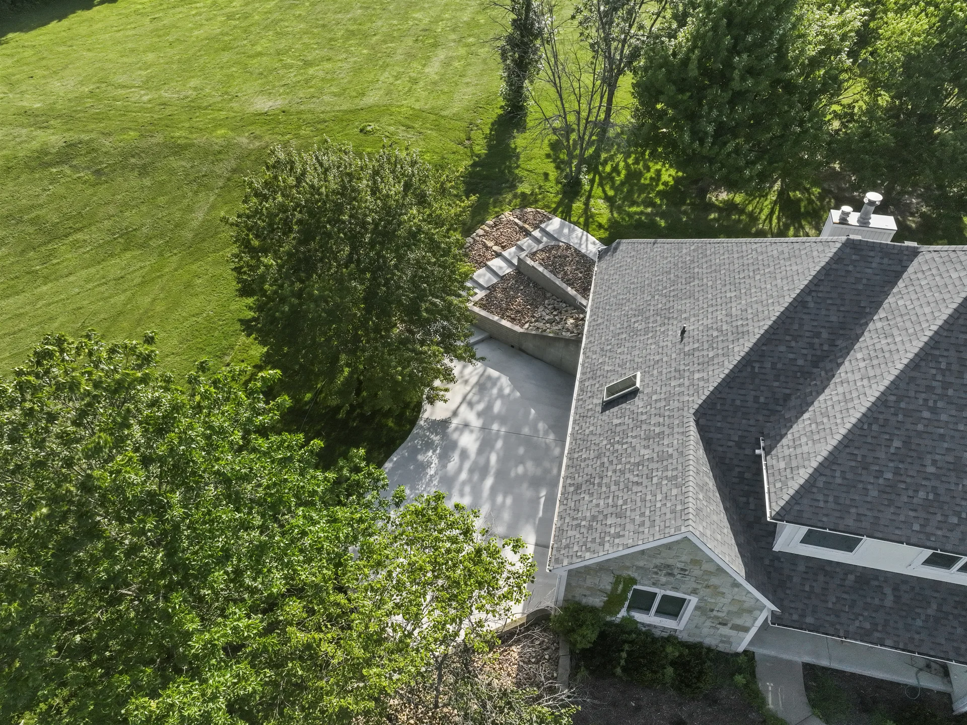 Aerial view showing the patio and surrounding grade