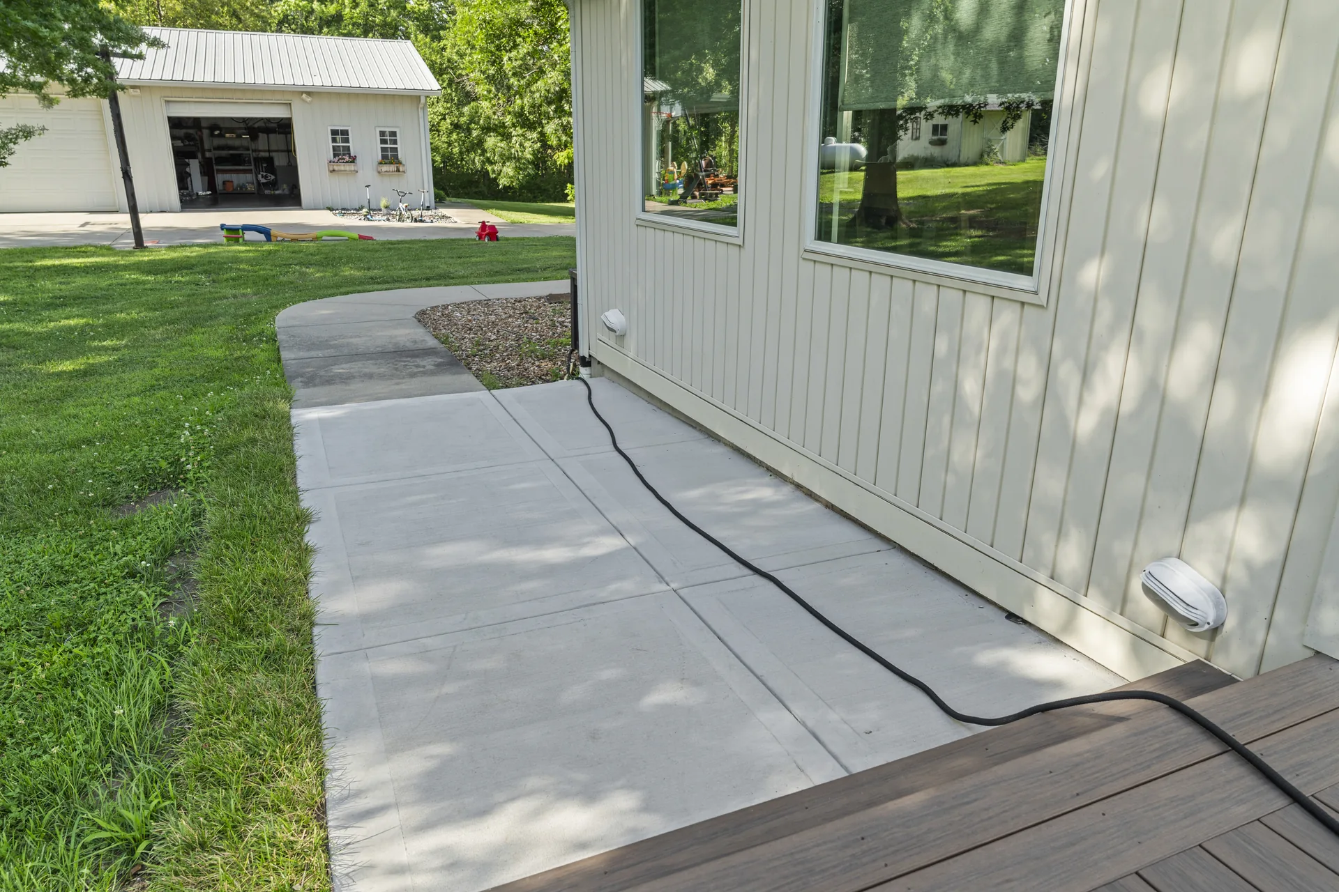 Concrete path following the house exterior