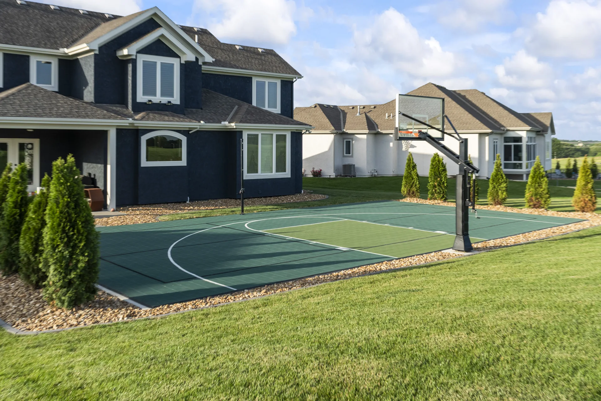 Painted court lines and surrounding lawn