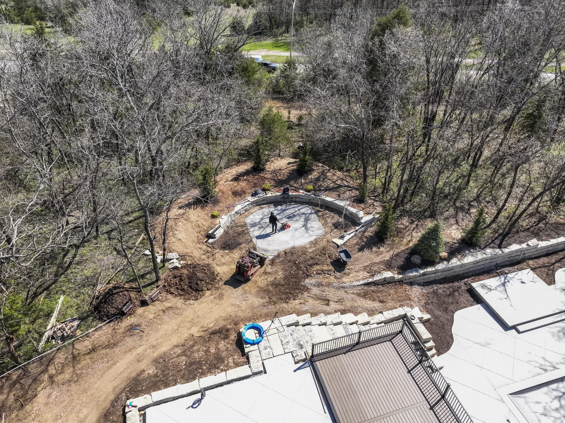 Early aerial view of earthwork behind the home