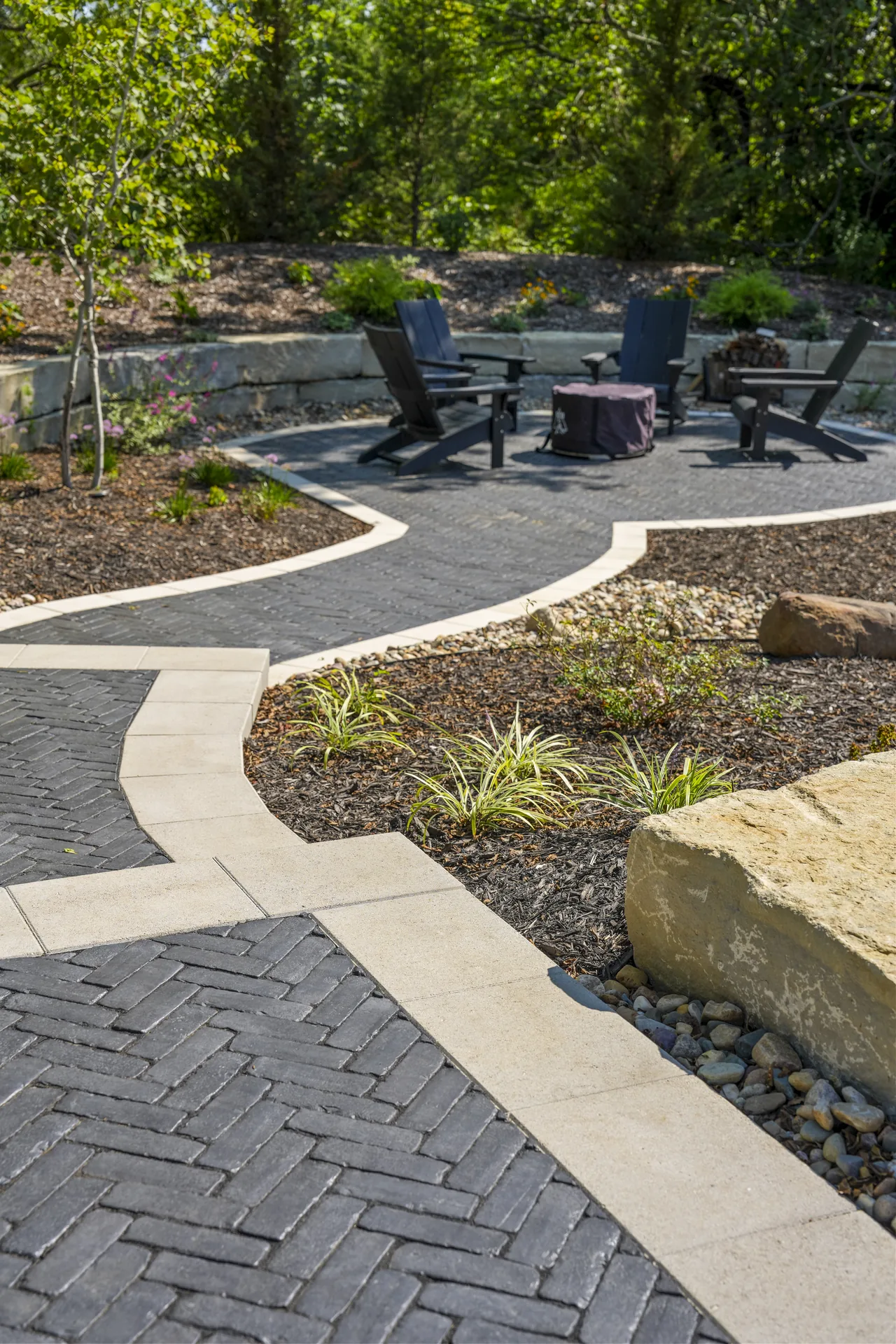 Contrasting paver border outlining the curved path