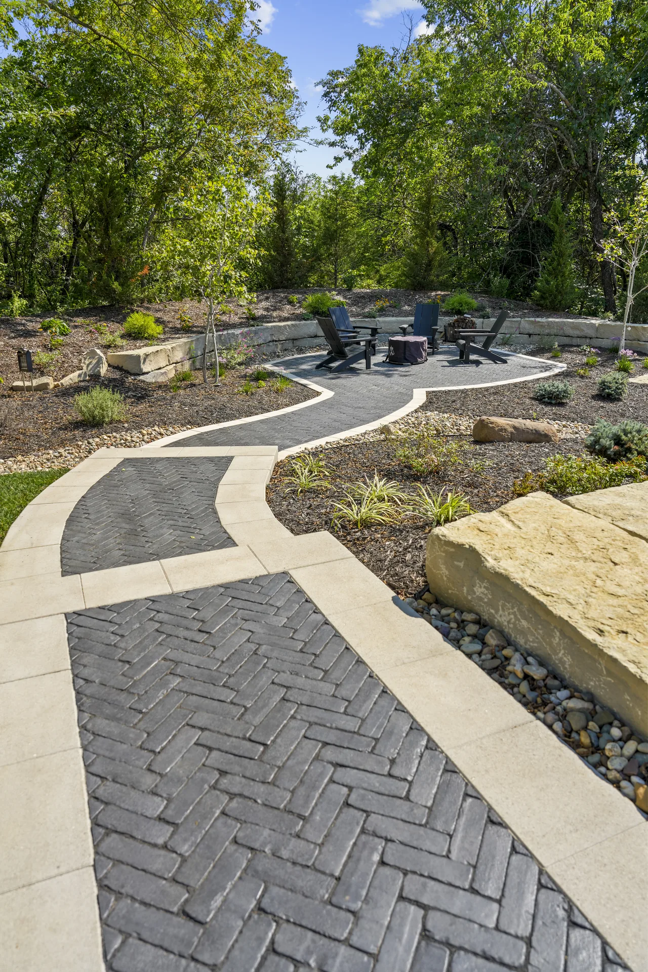 Paver walkway meeting a broader seating area