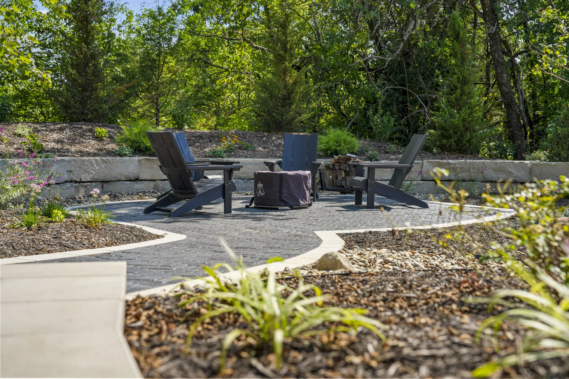 Planting beds edging the outdoor seating space