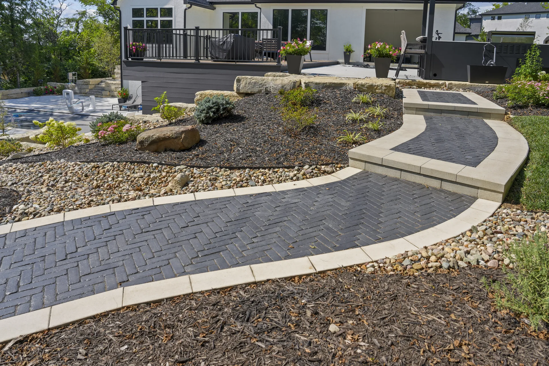 Wide view of the completed walk and paver patio