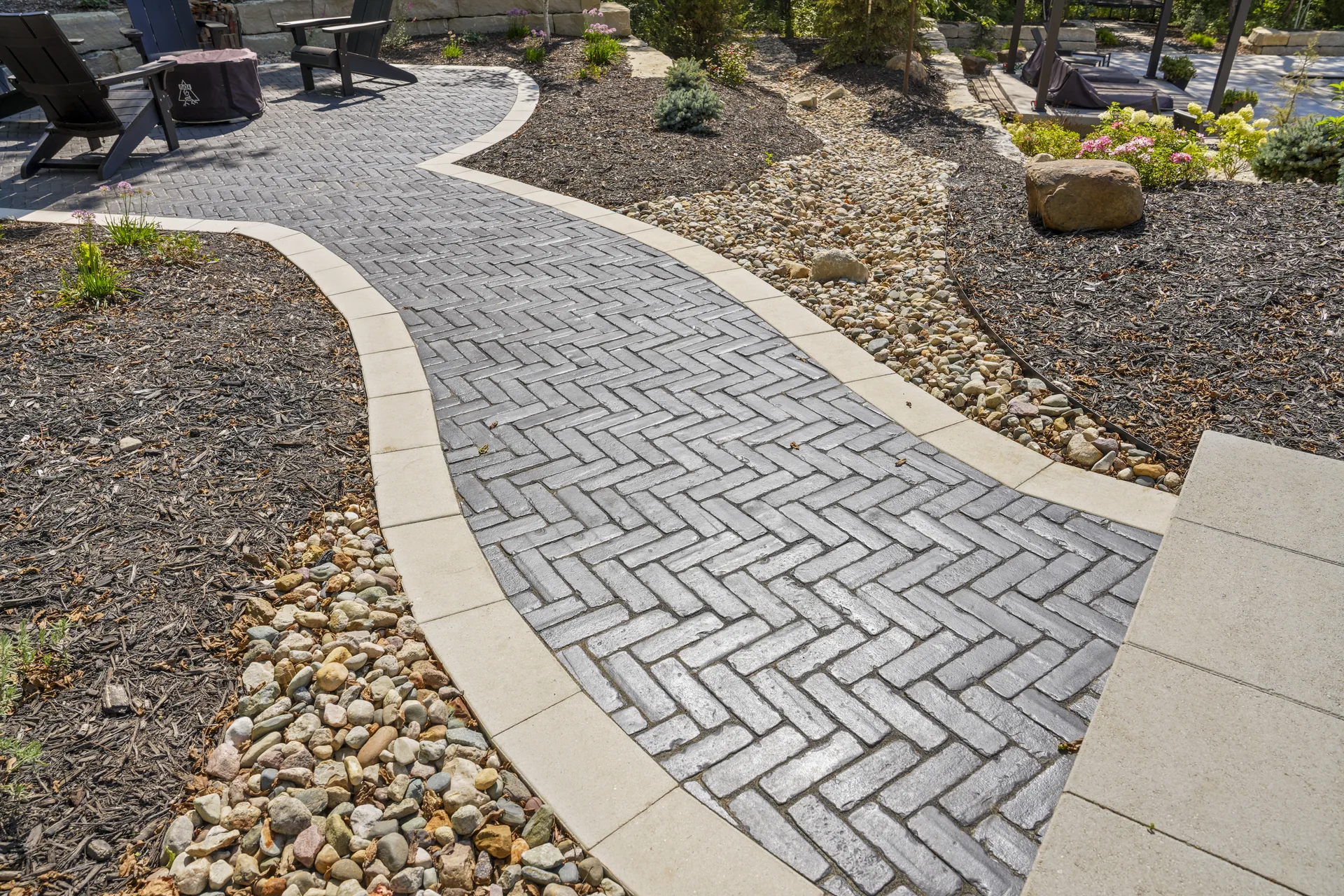 Stone-edged bed alongside the walkway