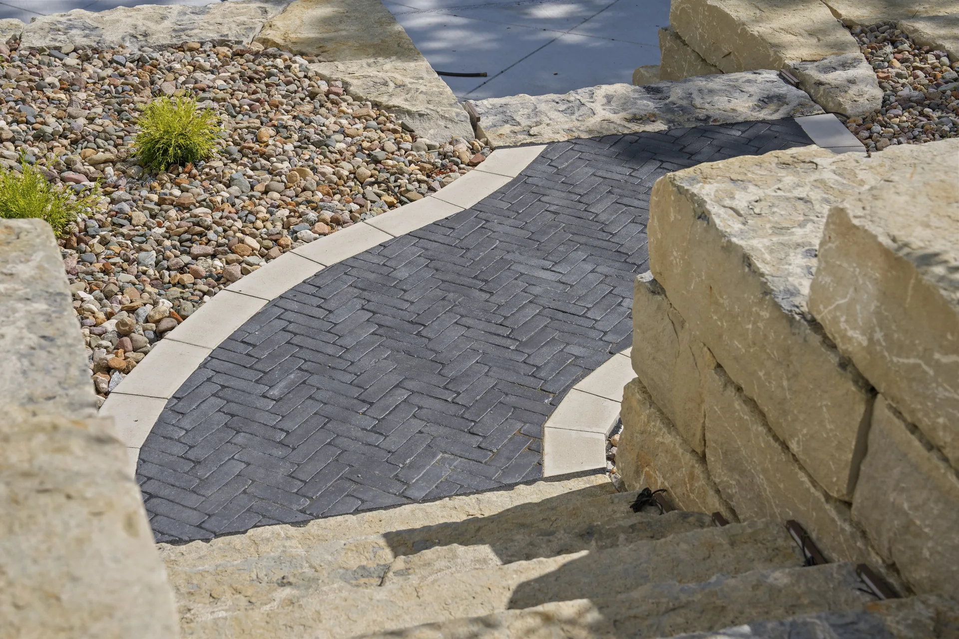 Walkway curve near the steps and planting area