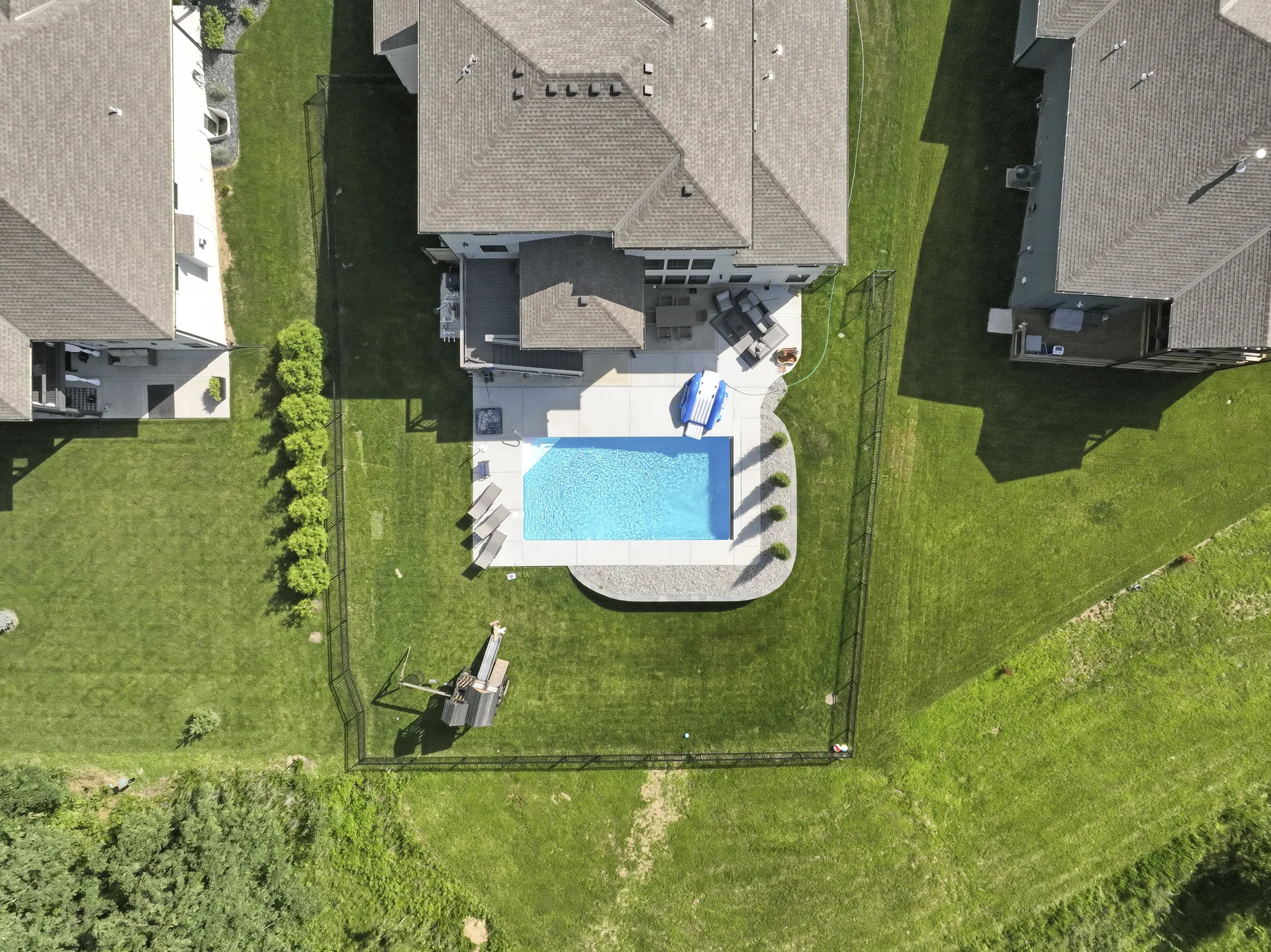 Overhead view of the pool and curved retaining wall