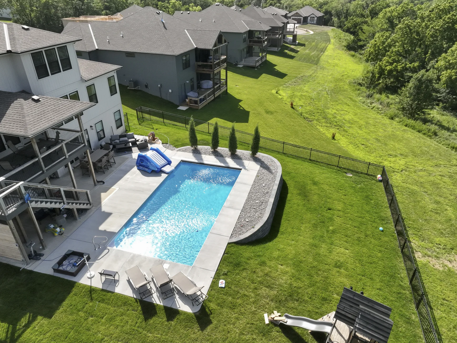 Aerial view of the backyard layout and curved wall