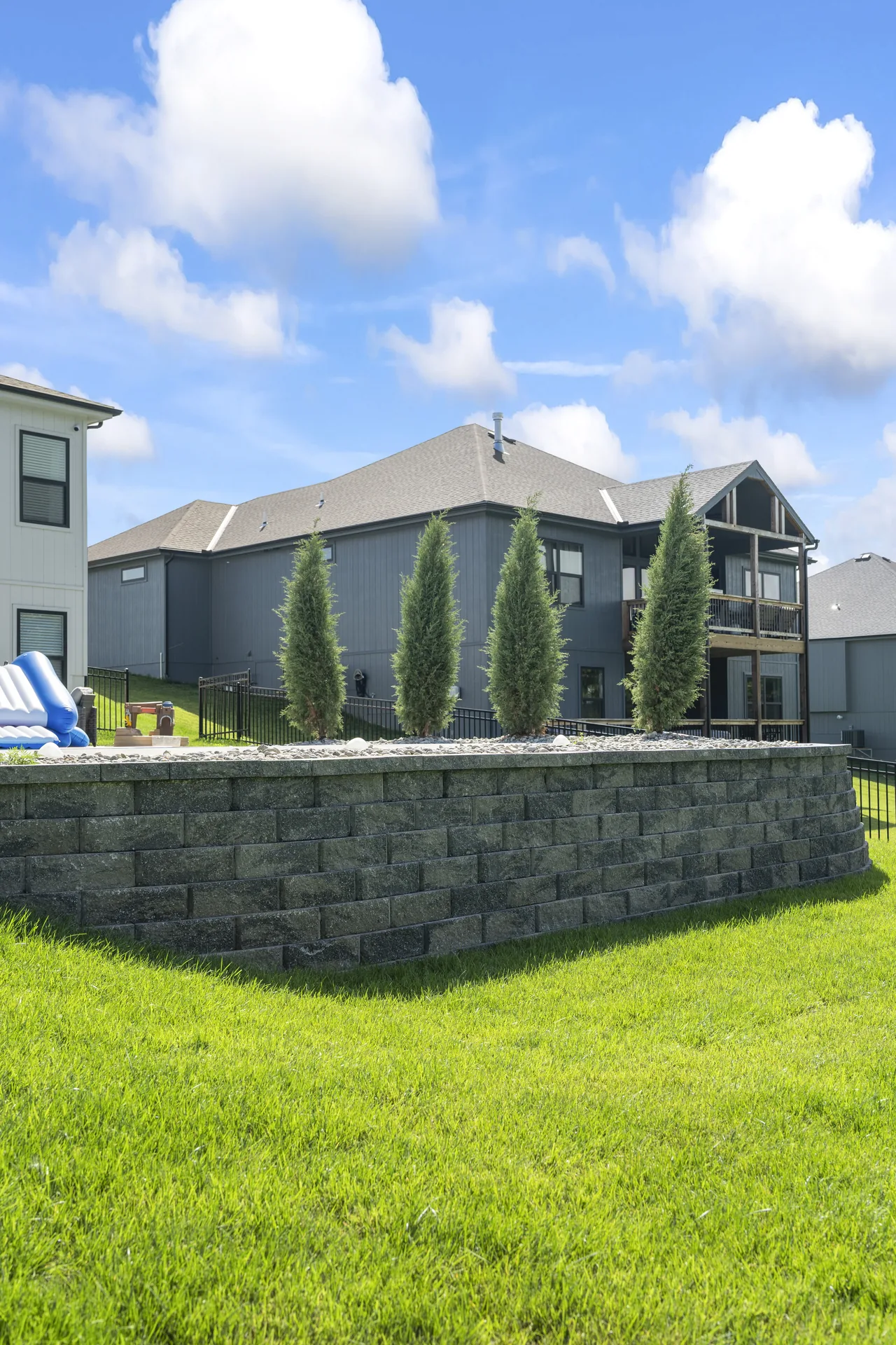 Evergreen planting above the block wall